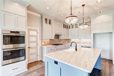 Kitchen professionally designed with a light and b