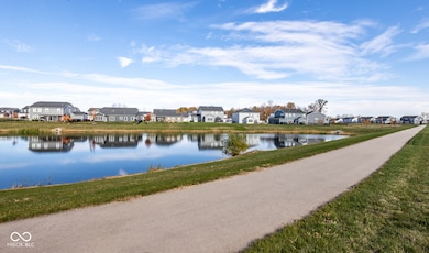 Home backs up to a private lake setting and walking trail.
