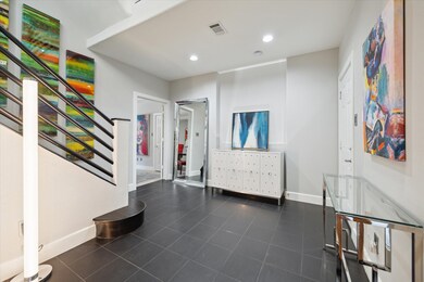 Front glass door opens onto this spacious foyer, w