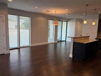 Kitchen featuring baseboards, dark wood finished 