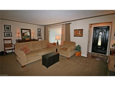 Neutral living room and entry foyer with newer fro