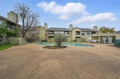 Community pool with a patio