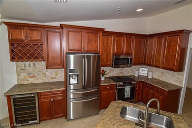 Your elegant kitchen features numerous upgrades.