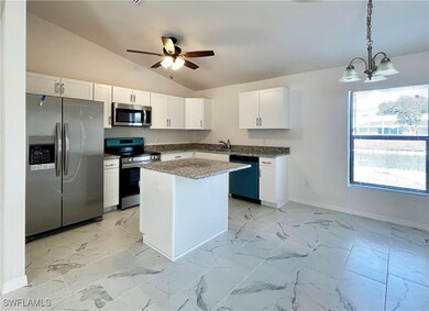 Kitchen featuring appliances with stainless steel