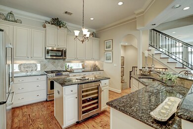 The island houses a Kitchenaid wine chiller