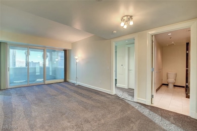 Living room with carpet flooring and baseboards