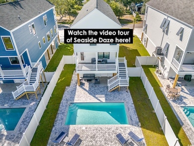 Back of property featuring a patio, stairs, a deck, a gazebo, and a community pool