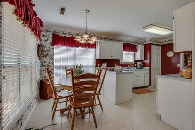 Kitchen eating area overlooking gorgeous treed yard