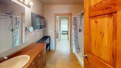 Full bathroom featuring a shower with curtain, van