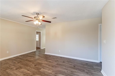 Spare room featuring a textured ceiling, ceiling f
