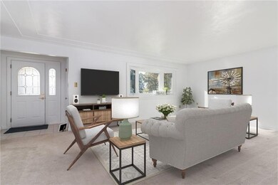 The main entry opens to a spacious living room wit