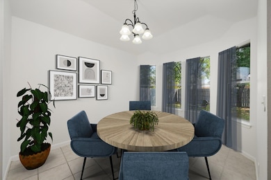 Dining space with light tile patterned flooring, 