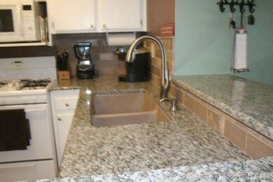 Stone tile back-splash and stone sink