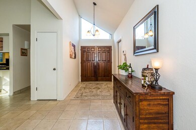 Tiled entry way with direct garage access.
