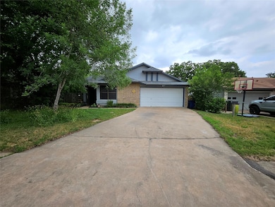 View of front facade with a front lawn, brick sid