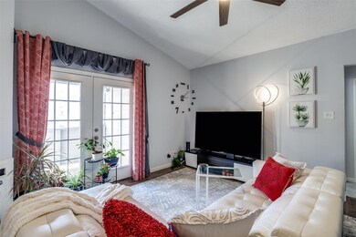 Living room with lofted ceiling, wood finished flo
