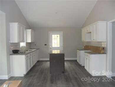 Kitchen open to the dining area and Living Room MU