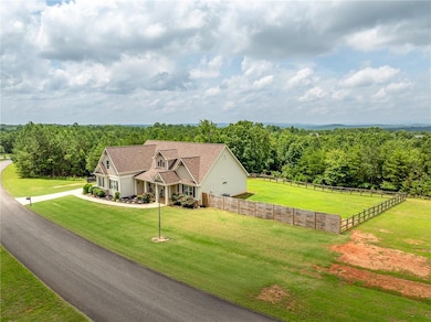 View of front of home with a shingled roof
