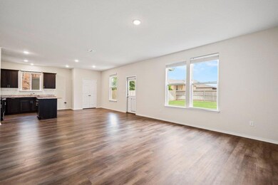 Unfurnished living room featuring dark wood finis