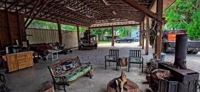Looking through the pole barn from the entry doors of the main house.