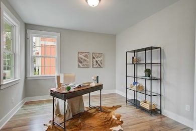 Office space featuring baseboards and wood finishe