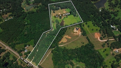 31+ Acres of rolling green space and beauty characterize this parcel.