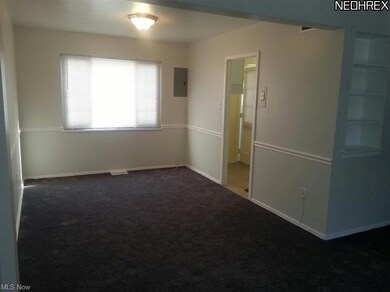View from dining room with glimpse of the kitchen.