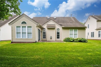 Back of property featuring a patio area and a yard