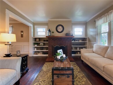 Living room with fireplace and built in book shelv