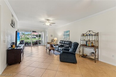 Tiled living room featuring ornamental molding and