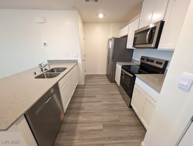 Kitchen with appliances with stainless steel finis