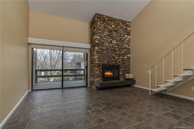 Open floor plan with rock fireplace