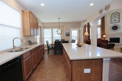 The kitchen!  You'll love serving friends and family at this island, with room for bar stools.  It's open to the living room, but separated by graceful arches and columns.