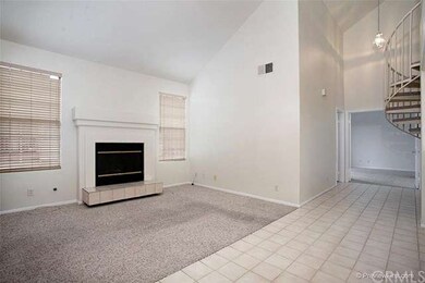 The living room has a fireplace with gas starter a