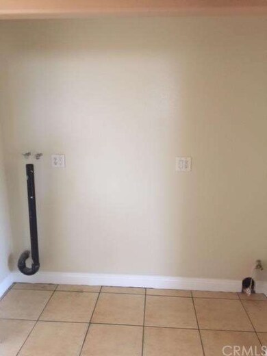 Upstairs unit. Washer and dryer  room. 