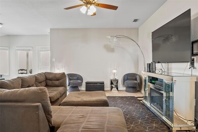 Living room featuring baseboards, visible vents, d