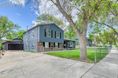 View of front of property with brick siding and a shingled roof