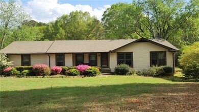 Single story home with a front yard