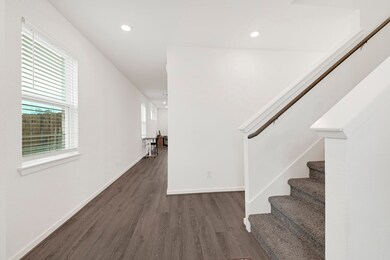 Bright and open hallway with luxury vinyl plank fl