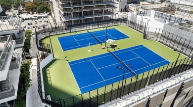 View of tennis court with fence