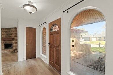 These 2 oversized arched windows allow tons of natural light.