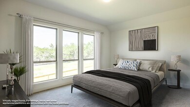 Bedroom with carpet flooring, baseboards, and vau