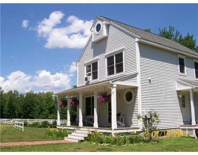 Exterior Front. Summer photo with...