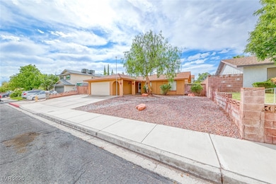 Single story home with concrete driveway, a garage