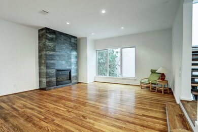 Living area has recessed lighting, gas-log firepla