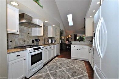 Spacious and neutral kitchen with granite counters