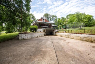 Plenty of parking in the driveway plus a large garage with a single door.