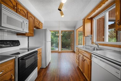 Efficient galley kitchen with some updated appliances.