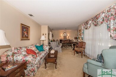 Spacious living room opens to the formal dining ro