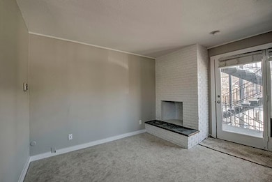 Unfurnished living room featuring carpet flooring,